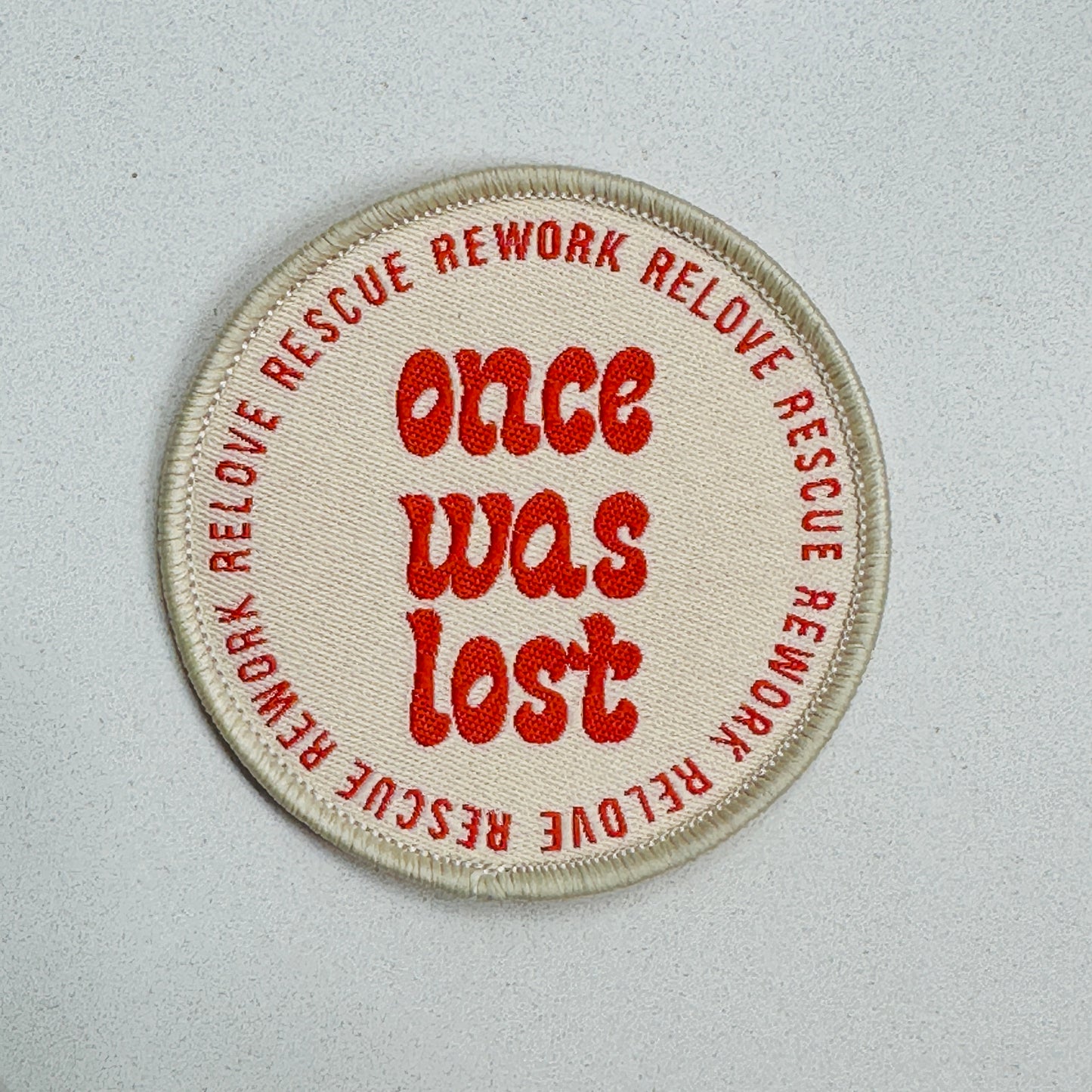 Once Was Lost 100% Recycled Badge